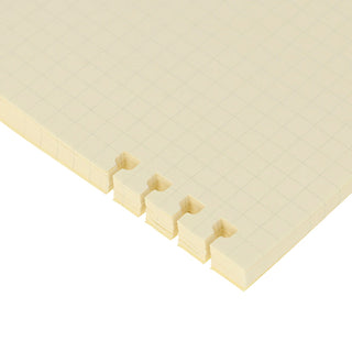Cream refill pages with snap-on tab-style binder edges and grid paper