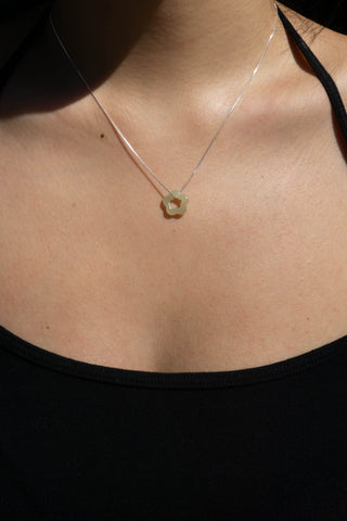 Jade flower sterling silver necklace with small pendant at collarbone