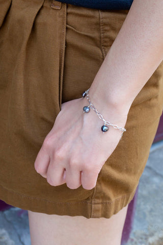 Silver-tone bracelet with petite links and green and dark bead charms