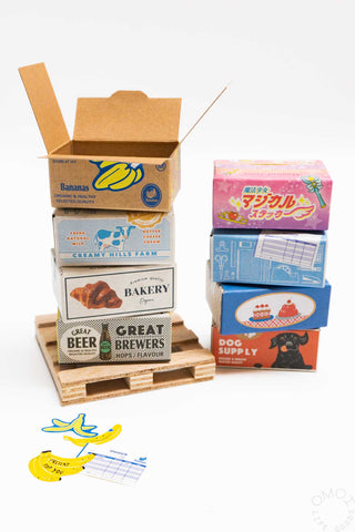 Food sticker seal box with open mini cartons and small sticker sheet