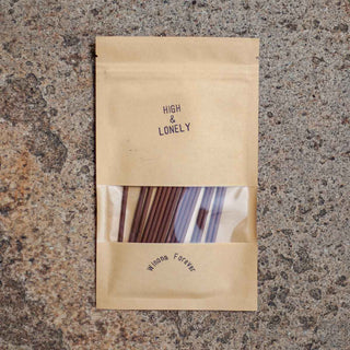 High & Lonely incense bag with visible wooden incense sticks and front brand label