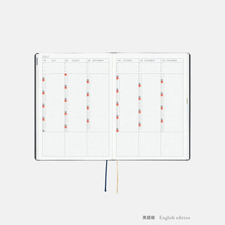 Navy A5 Hobonichi Techo slash planner, open layout with ribbon page ties