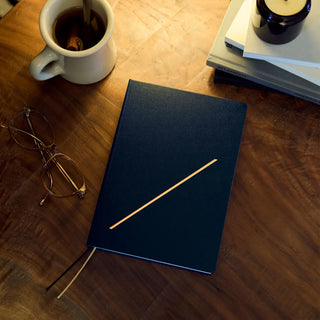 Navy A5 slash planner with gold diagonal line and two ribbon bookmarks