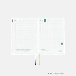 A5 slash planner opened with November and weekly grid pages, English edition and ribbons