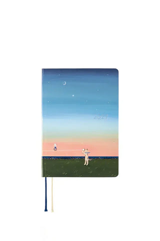 A6 planner with blue night sky cover and 2027 sunset illustration