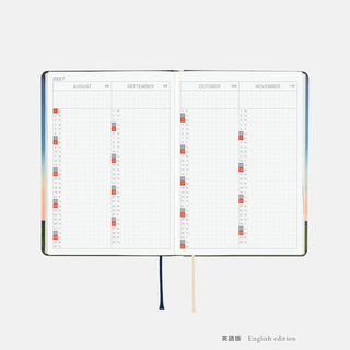 A6 planner open to calendar pages labeled August through November