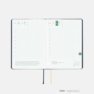 Hobonichi HON A6 slash planner open pages with date blocks and ribbon ties