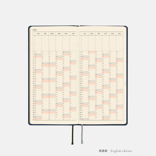 Opened 2027 planner spread with monthly grid and colored schedule bars
