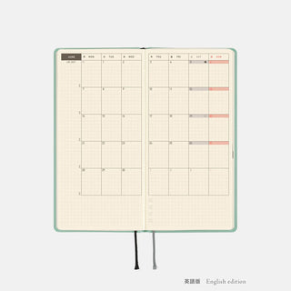 Open 2027 planner spread with detailed grid layout, black ribbon ties
