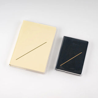 Hobonichi Techo HON A6 clear notebook cover, beige and black options shown