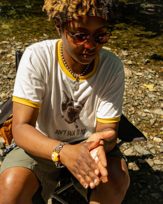 SPF 30 daily sun cream smoothed over face and hands, outdoors