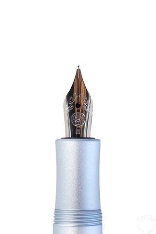Ice blue fountain pen nib with gold-toned nib and feed
