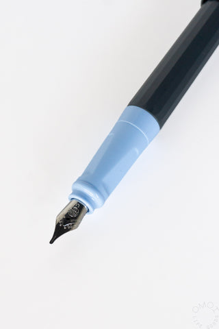 Light-blue calligraphy fountain pen tip with metal nib