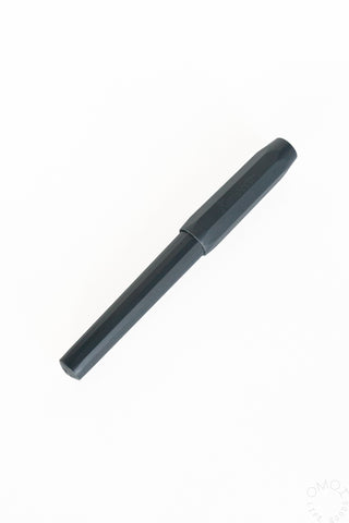 Dark-capped calligraphy fountain pen with slim barrel