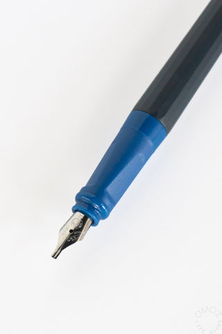 Blue ink reservoir calligraphy fountain pen with exposed metal nib