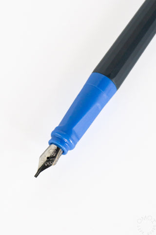Blue calligraphy ink pen with metal nib and dark body