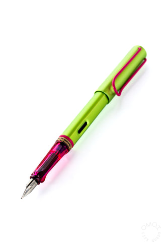 Lamy AL-Star Disco fountain pen close-up, fine nib; lime green body with magenta grip
