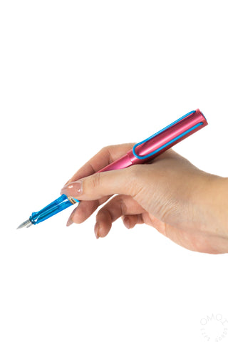 LAMY AL-Star fountain pen in hand, pink cap and blue body