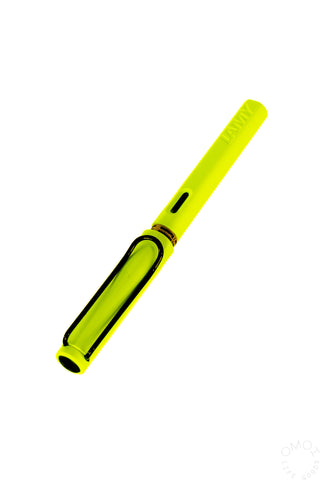 Neon yellow LAMY Safari fountain pen with fine nib, angled view