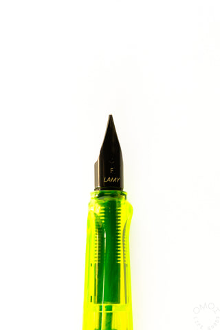 Neon yellow LAMY Safari fine nib fountain pen with nib close-up