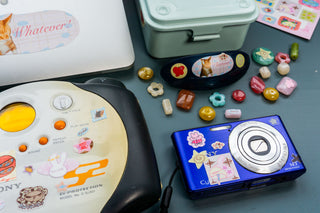 Lucky bears sticker sheet and colorful bear stickers arranged around a decorated camera