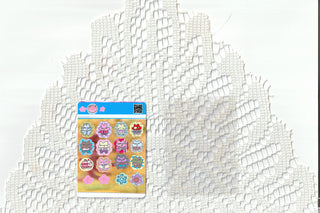 Lucky bears sticker sheet shown on textured white surface, blue bordered sticker designs