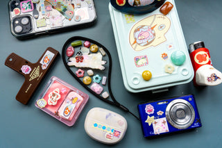 Pink sticker icons on accessories, with smiley character designs and hearts