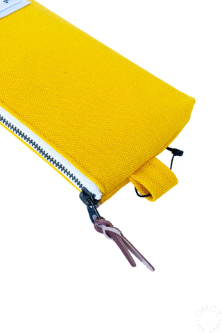 Yellow pen case corner with metal zipper and zipper pull tab