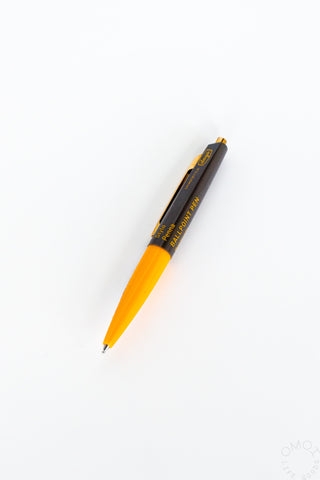 Orange and black mini ballpoint pen with gold-colored tip