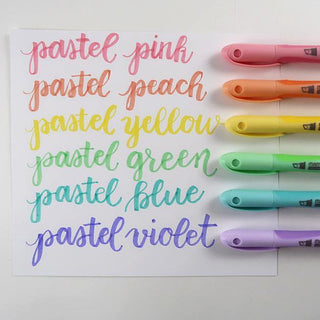 Pastel ink liner markers and color swatches: pink, peach, yellow, green, blue, violet