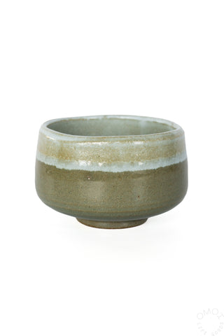 Green glazed matcha chawan with speckled finish and rounded rim