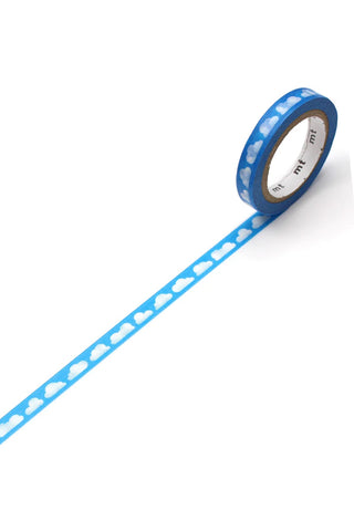 Blue washi tape with white cloud pattern, unrolled strip from a roll