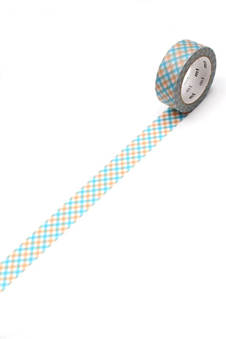 Washi tape with blue and orange check pattern, adhesive roll end visible