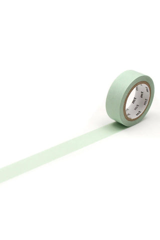 Pastel mint green washi tape roll with straight tape strip extending