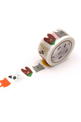 Washi tape roll with illustrated animal faces and creatures in brown and green