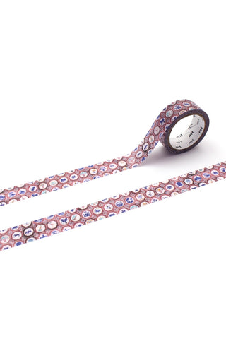Pink and blue patterned washi tape roll with repeating decorative motif strip