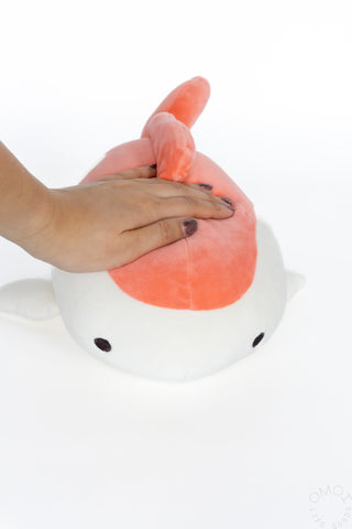 Small plush goldfish hug pillow held in hands; white body with orange-pink head fin