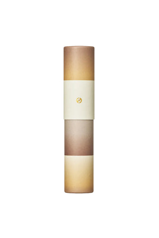 Gradient incense tube, stacked bands of dark brown, cream, and beige with logo seal