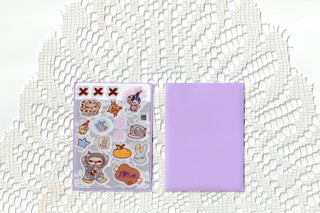 Transparent sticker sheet with cartoon icons beside a purple backing card