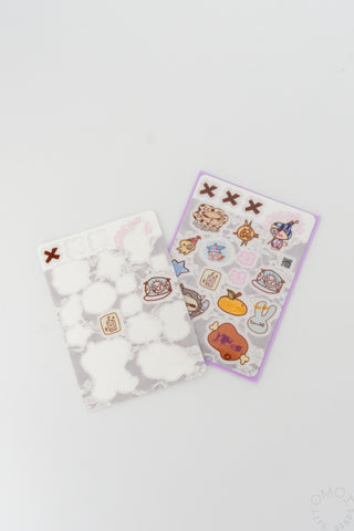 Transparent sticker sheet and translucent sheet of small icons with cartoon faces