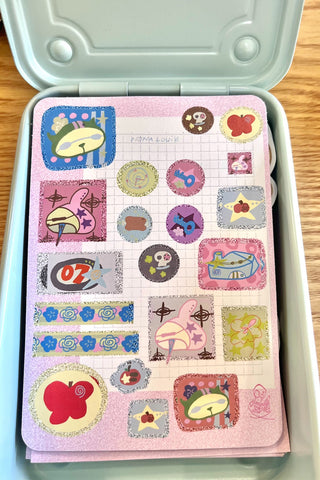 Square sticker sheet with assorted kawaii character and item icons in pink