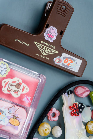 Sticker sheet in clear pouch with cute character and star designs