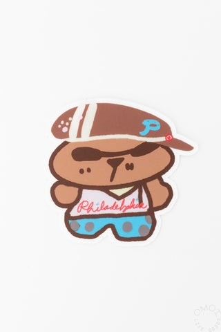 Die-cut brown bear character sticker with blue shorts and Philadelphia text