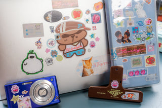 Sticker set sheet featuring a die-cut bear character and assorted cute icons in a frame