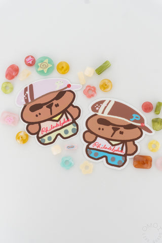 Pair of die-cut brown bear character stickers with Philadelphia shirts and small icons