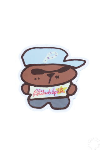 Mascot sticker with brown character, blue hat, and red 'Philadelphia' text