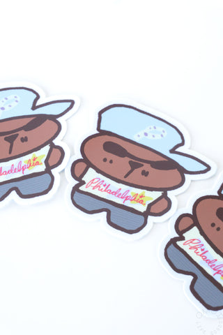 Die-cut mascot sticker set featuring brown characters with blue hats and red Philadelphia text