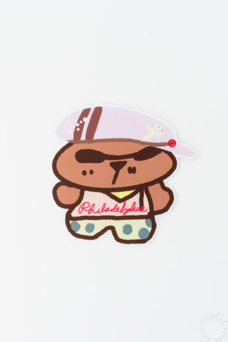 Cartoon Philadelphia character sticker, smiling dog in cap with 'Philadelphia' text