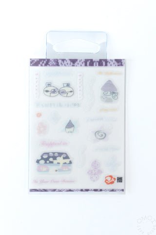 Sticker sheet with purple-and-cream icons, faces, flowers, and small symbols