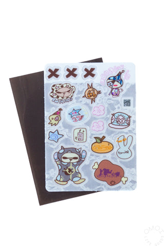 Opaque clear sticker sheet with cute icons, placed over a dark backing card